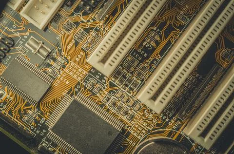 Computing chip on an old motherboard. Old electronics close-up. Selective focus Stock Photos