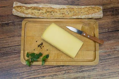 Comté cheese slice Stock Photos