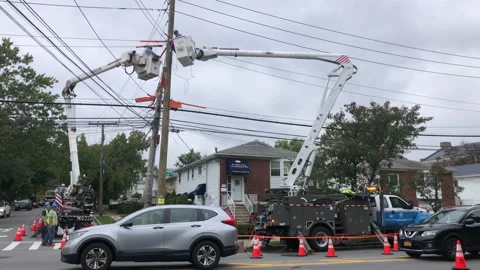 Con Edison Electric Utility Workers on Bucket Lifts residential Neighborhood Stock Footage 171363089