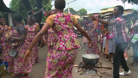 Conakry, Republic of Guinea - June, 14, 2015. African girls dancing on a picnic Stock Footage