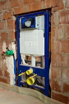 Concealed toilet installation frame inside unfinished brick wall background 写真素材
