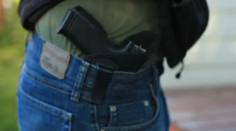 Concealed weapon Handgun Under a Coat Video stock 24490055