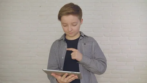 Conceived young boy looking on his table. Stock Footage 83958896