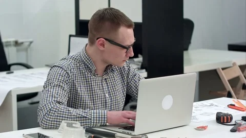 Concentrated architect designing new project on laptop 動画素材 71608028