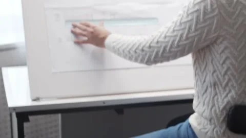 Concentrated architect works in loft using drawing board. Workplace of young Stock Footage 142587226