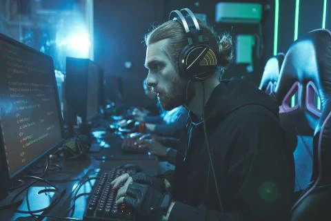 Concentrated bearded guy examining script Stock Photos
