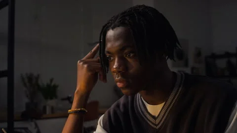 Concentrated Black Man Working Late on Laptop Computer in Office Stock Footage 338415406