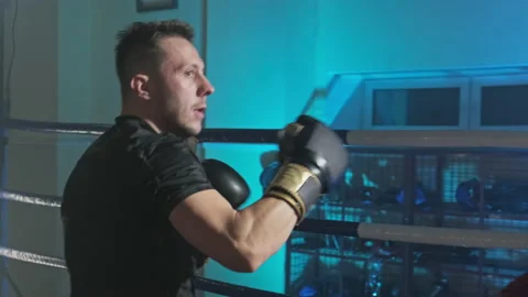 Concentrated boxer training with trainer. Box practise. Workout together. Stock-Footage 144873941
