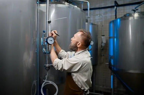 Concentrated brewer writing data pressure gauge valve during brewing process Stock Photos
