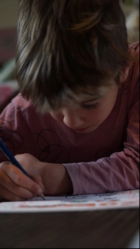 Concentrated child drawing at home Stock Footage 254411662