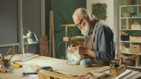 A Concentrated Elderly Man Makes Handicrafts, Knits a Product, Enjoys Leisure Stock-Footage 169895535