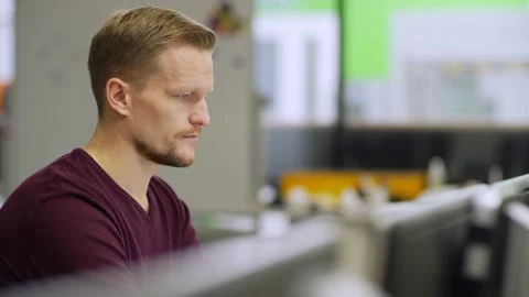 Concentrated engineer working on computer Stock Footage 142162588