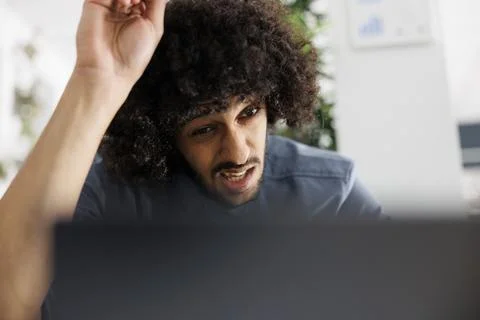 Concentrated executive manager solving complex business task on laptop Stock Photos
