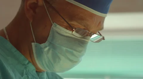 Concentrated face surgeon Stock Footage 64420407