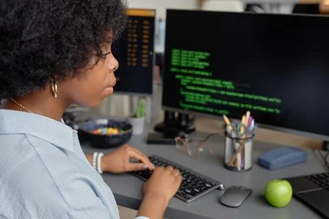 Concentrated Female Programmer Working on Computer Stock Photos