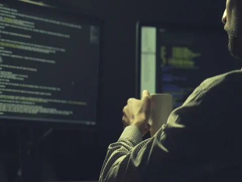 Concentrated hacker cracking a database Stock Footage 75019823