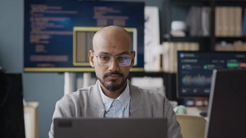 Concentrated Indian Programmer Working on Laptop in IT Office Video stock 337489302