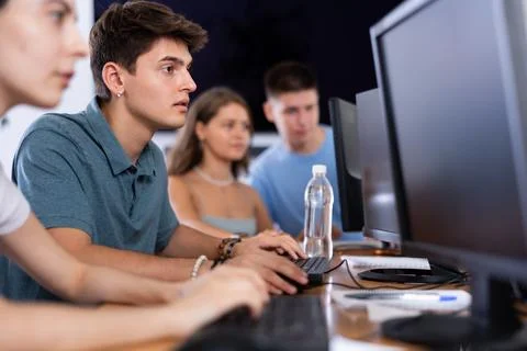 Concentrated junior software developer working in IT startup Foto stock