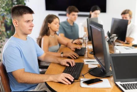 Concentrated junior software developer working in IT startup 写真素材