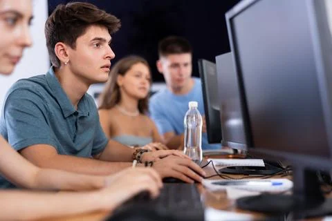 Concentrated junior software developer working in IT startup 写真素材