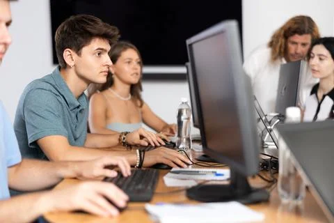 Concentrated junior software developer working in IT startup Foto stock