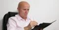 Concentrated Lawyer Working Analyzing Case Information Man Making Diary Notice 4k or 4k+ Resolution