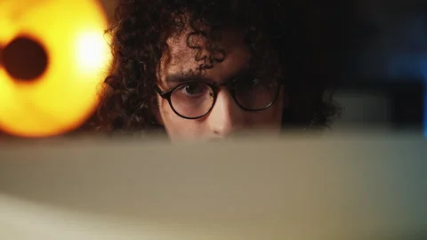 Concentrated male programmer in eyeglasses working on retro computer, 80s style Stock Footage 321072568