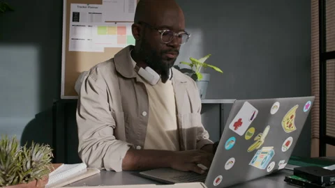 Concentrated Male Software Engineer Working on Laptop at Desk in Office Video stock 299212189