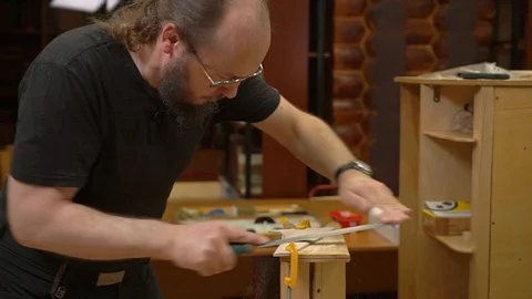 Concentrated man with beard polishes outdated aircraft model 스톡 동영상 127112729