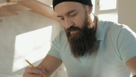 Concentrated man draws with a pencil. Creative work. Close-up. Stock Footage 120685725