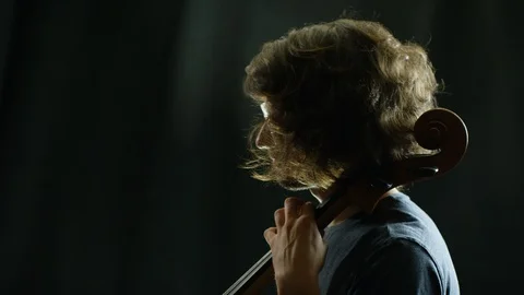 Concentrated man playing a cello Stock Footage 109271264