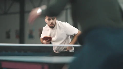 Concentrated man playing a competitive table tennis match Stock Footage 327893897