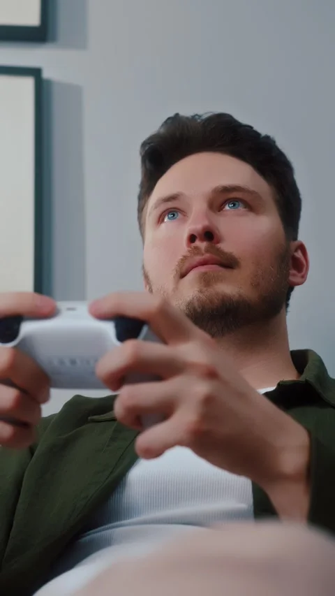 Concentrated man playing video game with controller Video stock 322569806