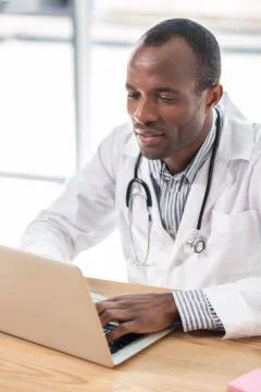 Concentrated man typing his dissertation Stock Photos