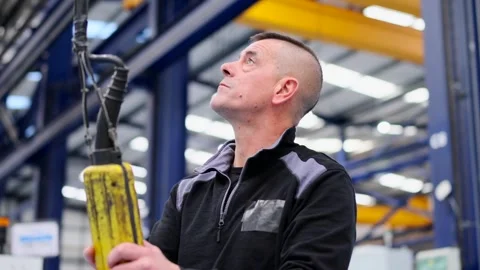 Concentrated man using crane control Stock Footage 262282771