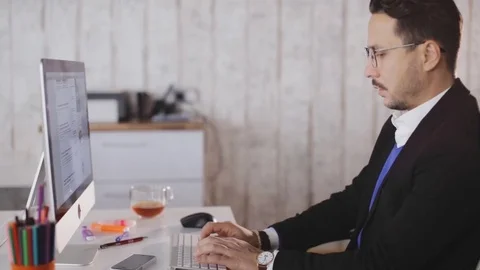 Concentrated man work with computer in the office 스톡 동영상 83609255