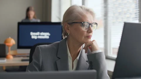 Concentrated Mature Female Developer Working in Open Space Office Stock Footage 321046698