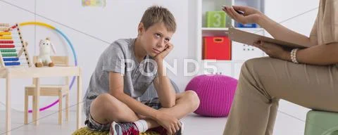 Concentrated, or rather bored? Stock Photos