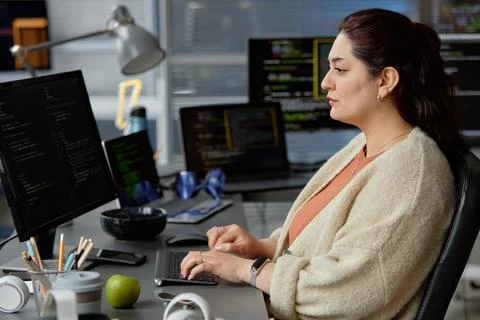 Concentrated Plus Size Female Programmer Typing Source Codes Stock Photos