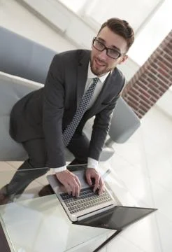 Concentrated professional IT developer with laptop 스톡 사진