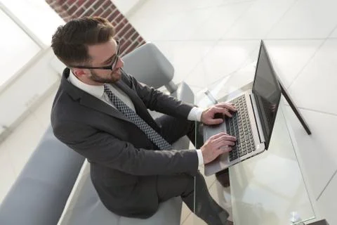 Concentrated professional IT developer with laptop 库存照片