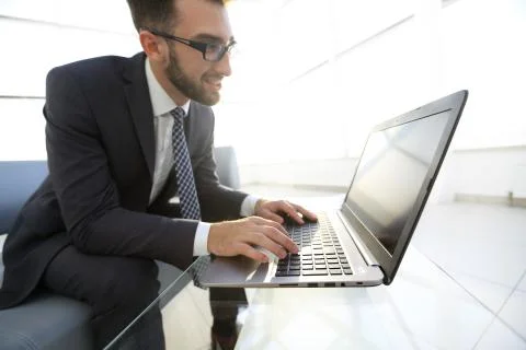 Concentrated professional IT developer with laptop 写真素材