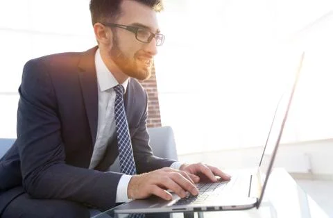 Concentrated professional IT developer with laptop 写真素材