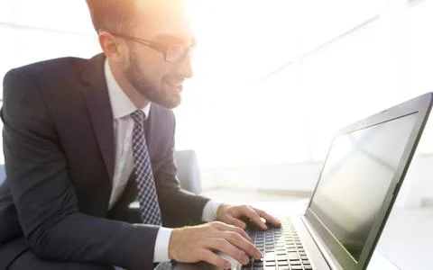 Concentrated professional IT developer with laptop Foto stock