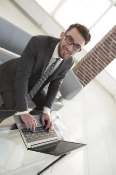 Concentrated professional IT developer with laptop 스톡 사진