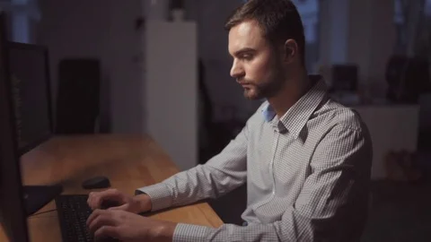 Concentrated programmer being involved in work Stock Footage 75012137