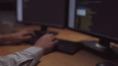 Concentrated programmer organizing a computer attack Stock Footage 75012897