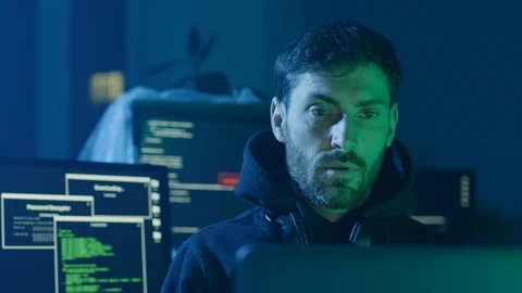 Concentrated programmer typing data codes on laptop looking at interface Stock Footage 108823764