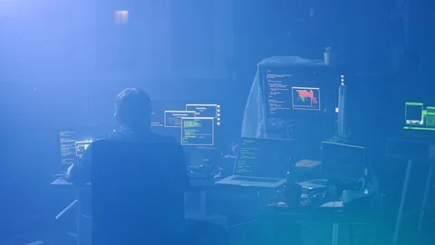 Concentrated programmer writing codes and typing data code technology working on Stock Footage 108827231