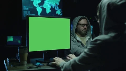 Concentrated Programmers Work on Personal Computers Located in a System Control  Stock Footage 70582640